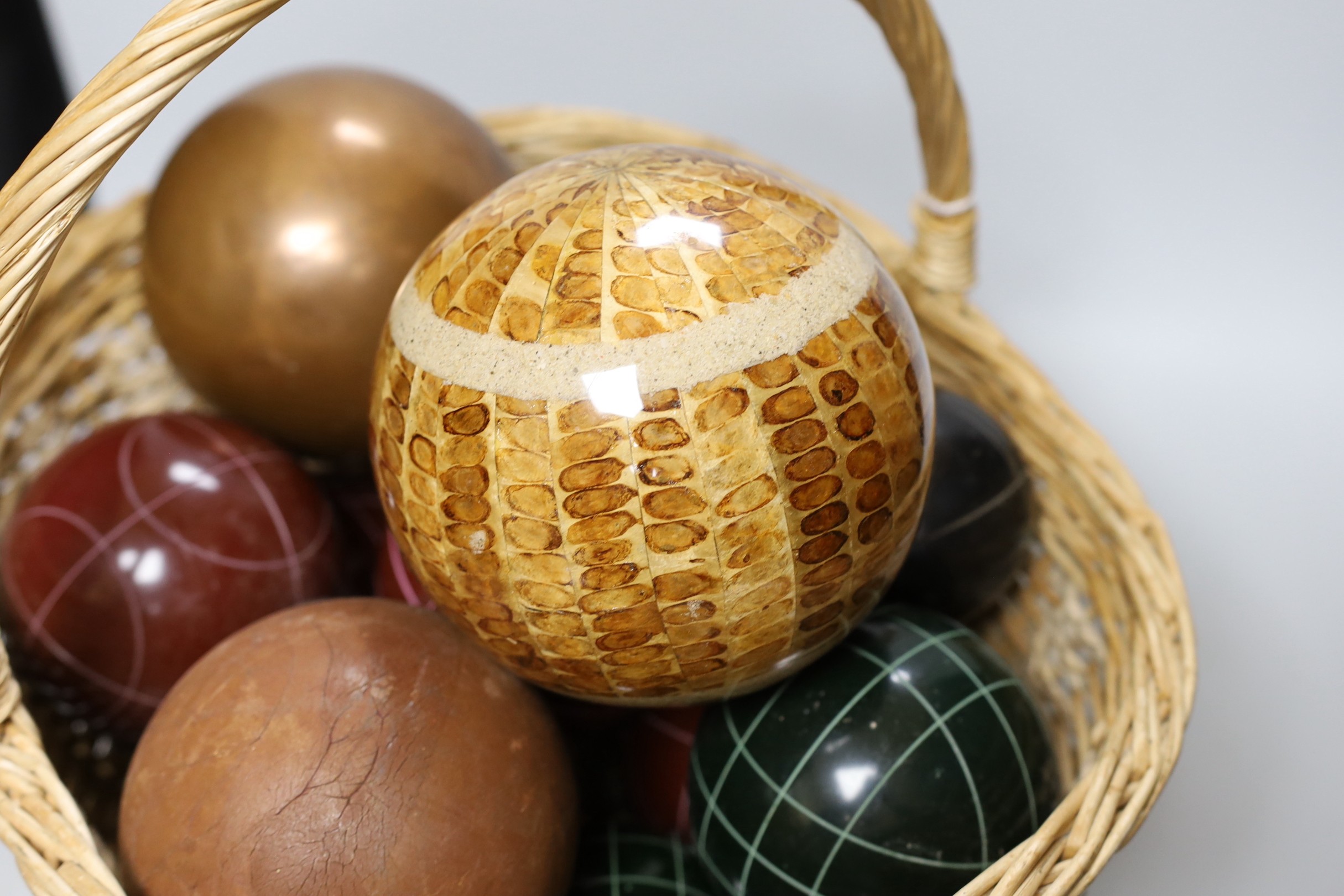 A basket of decorative varying sized balls